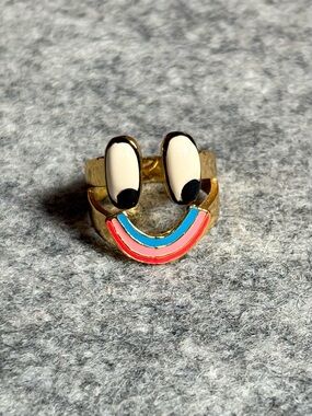 Lazy Oaf Gold Tone Ring with Cream, Black, Pink and Blue Enamel Smile